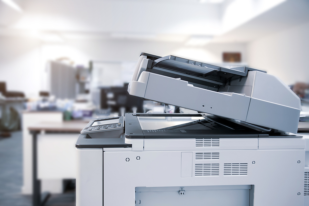 The photocopier or network printer is office worker tool equipment for scanning and copy paper.